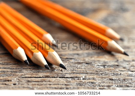A close up image of several loose yellow pencils. 