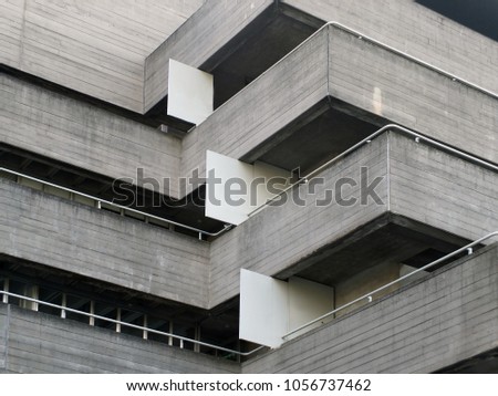 details of railings and balconies on an old brutalist concrete building Royalty-Free Stock Photo #1056737462