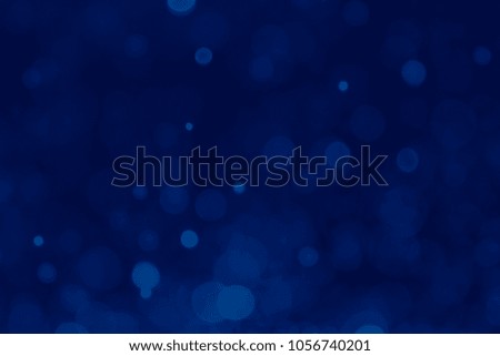 Abstract Blue bokeh background. Blurred bright light. Circular points. Colorful. Defocused background.
