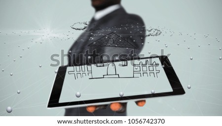 Digital composite of Midsection of businessman showing house on tablet PC's screen