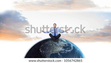 Digital composite of Businessman meditating on globe against sky