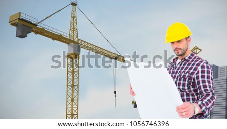 Digital composite of Architect holding blueprint against crane