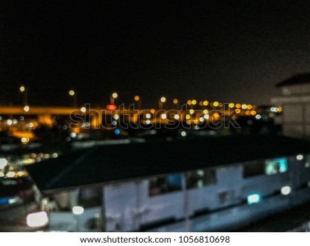 City - blurred background image with bright light