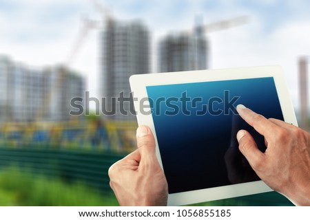 Man holding digital tablet on natural background