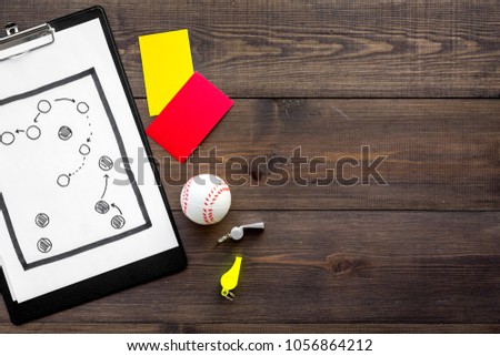 Sport judging concept. Baseball referee. Tactic plan for game, base-ball ball, red and yellow cards, whistle on wooden background top view copy space