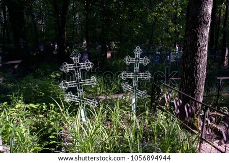 Crosses on the graves of the nuns. Christian crosses with Jesus.