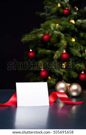 White card in elegant Christmas decoration. The card can be used for personal Holiday or Christmas greetings.