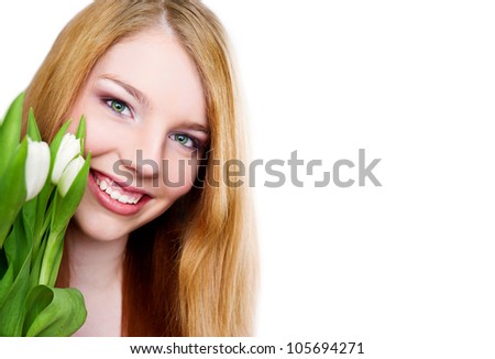 young smiling girl with tulips bouquet on white background