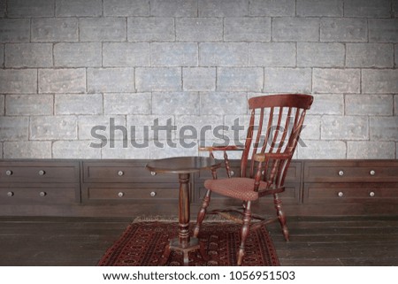 Old antique wooden chair and table in the room, Have a brick wall