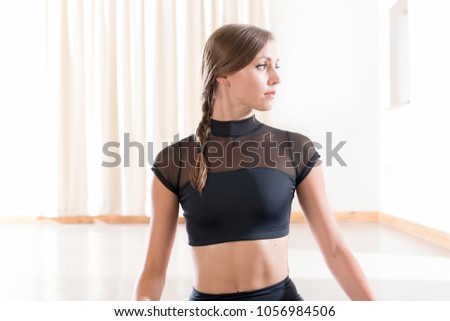 Portrait of a young woman in a black crop top