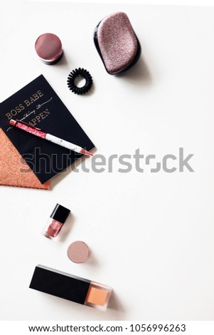 Woman's glamour glitter beauty products flatlay on white background. Fashion blogging concept. Copyspace
