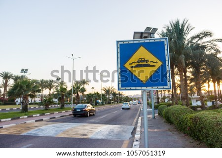 Speed Bump sign on the sunny road in Egypt.