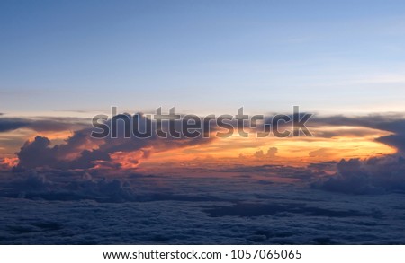 cloudy sky and sunset twilight background top view from airplane window
