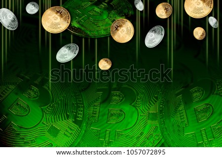 Golden and Silver Bitcoins on green background,Bitcoins concept of developing a new virtual currency. for background