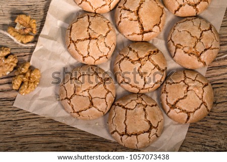 Top View Of Chewy Cracked Walnut Cookies On Rustic Wooden Table