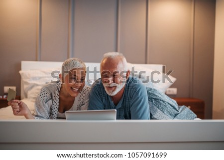 Senior couple doing some online shopping