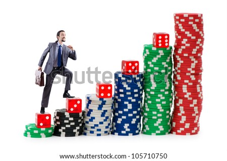 Businessman climbing stacks of casino chips