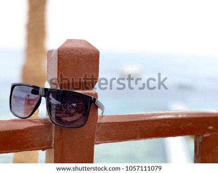sunglasses on the background of the sea