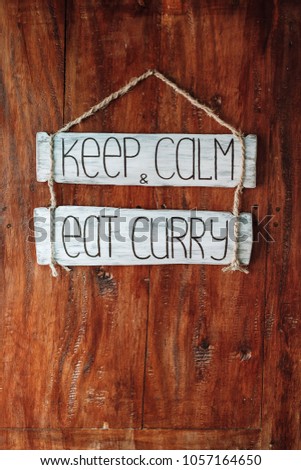 "Keep calm and eat curry" wood sign