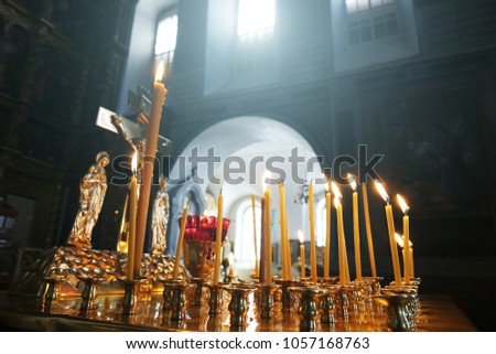 Candles in the Church on the background of the window.