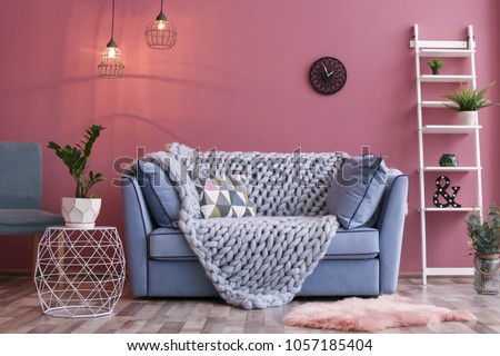 Cozy living room interior with comfortable sofa Royalty-Free Stock Photo #1057185404