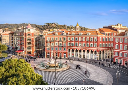 Aerial view of Place Massena square with red buildings  and fountain in Nice, France Royalty-Free Stock Photo #1057186490