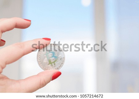 bitcoin in women hand