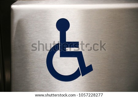 Disabled sign stainless blue in elevator symbol wheelchair background 