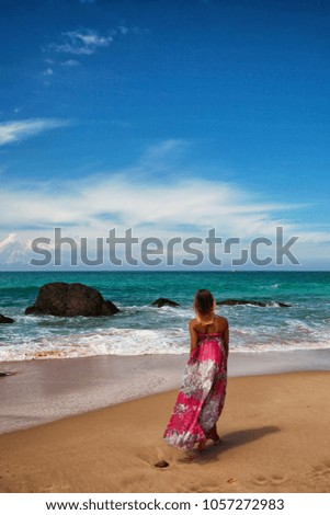 The girl on the beach on the ocean