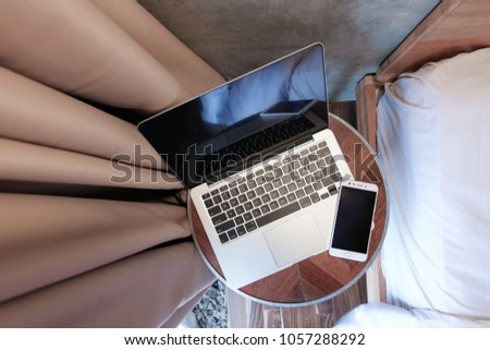 Mock Up Mobile Phone and Laptop. Hand in frame. Casual enjoy working