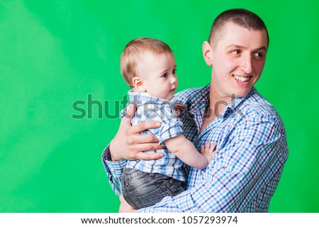 happy father plays with a baby