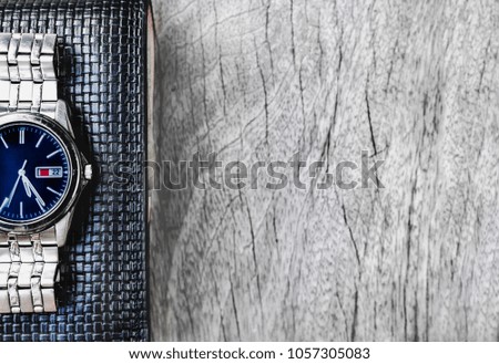 Wallet and wristwatch used regularly every day for men. with copy space for your text.