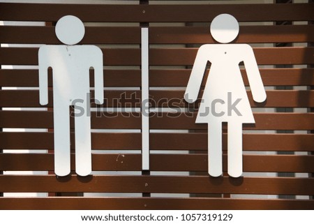 Badges for men and women at toilet in the park.