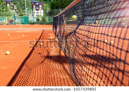 Tennis ball hitting the tennis net at tennis court