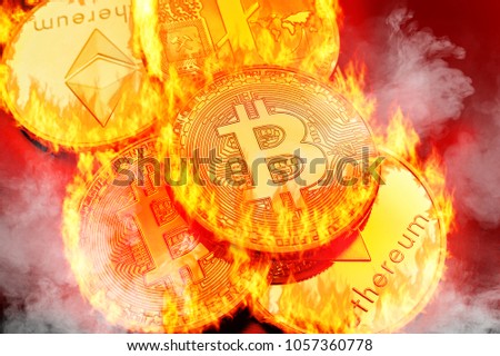 Conceptual picture of cryptocurrency coins bursting into flames, illustrating crypto-currency market crash