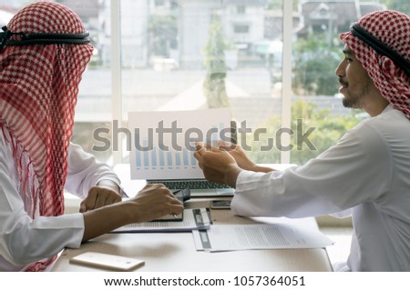 Picture of two Arabian businessman  working and meeting in team with reports to success at workplace in office