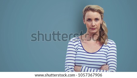 Digital composite of Confident female hipster standing arms crossed against blue background