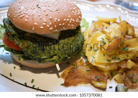 Veggie burger with roasted potatoes