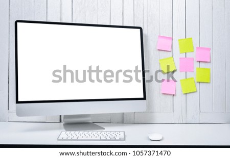 workplace background for designers with Blank white screen modern desktop computer, keyboard, Post-it White wooden vintage blackground