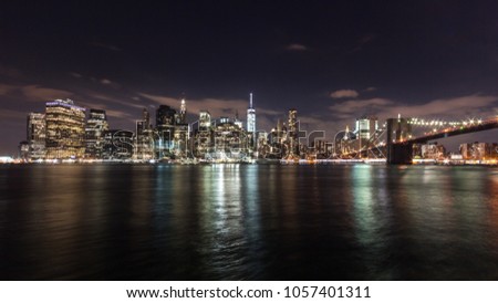 Manhattan Skyline and Brooklyn Bridge at Night