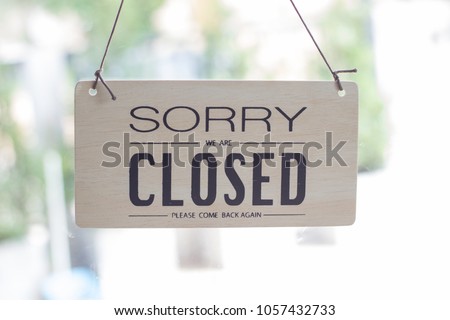 A sign hanging off Coffee shop door,Close sign blur background,Label word close 