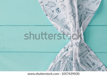 Served Table with light Crumpled kitchen Napkin Top View Minimal Picture on turquoise wooden Background
