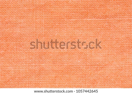 close up of light orange colored fabric texture.