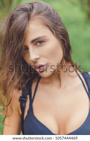 portrait of beautiful girl posing and looking at camera