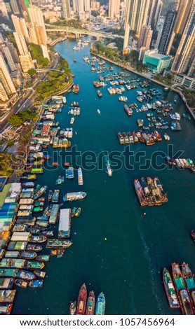 Aerial Top View of The Aberdeen Bay and Skyscrapers on two sides of the harbour in Southern District,Hong Kong.