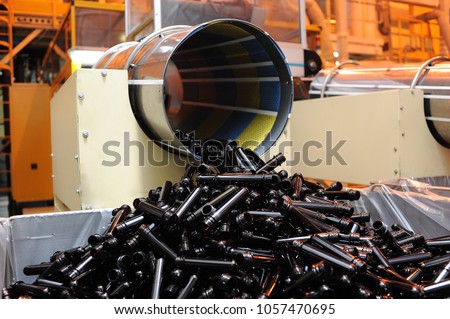 big pile of small pet preforms to create plastic bottles