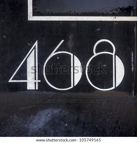 house number four hundred and sixty-eight. White lettering on a black background