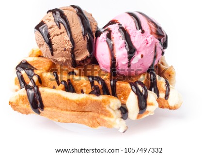 Belgian waffles with ice-cream on white background Royalty-Free Stock Photo #1057497332