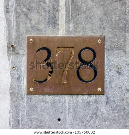 house number three hundred and seventy-eight engraved in a copper plate.