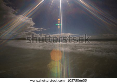 Colourful of sunshining glaring reflection picture on the beach 